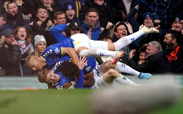 Everton’s Anthony Gordon (bottom) celebrates scoring the winning goal against Manchester United