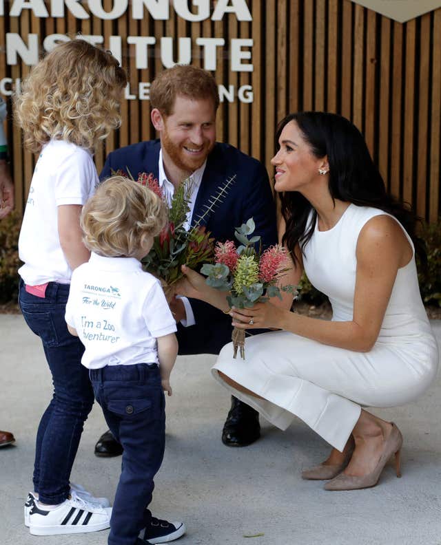 Harry and Meghan with children