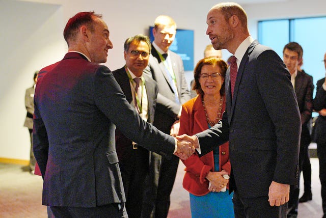 William shakes hands