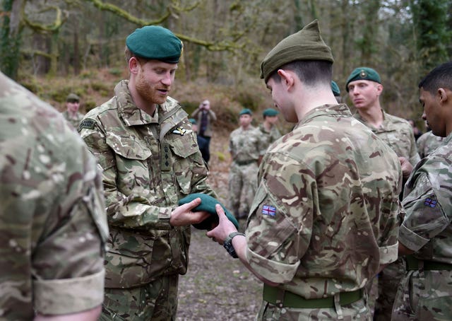 The Duke of Sussex carries out a Green Beret presentation during a visit to 42 Commando Royal Marines at their base in Bickleigh (Finnbarr Webster/PA)