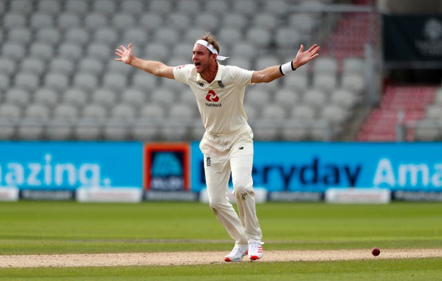 England's Stuart Broad celebrates successfully appealing the lbw of Masood 