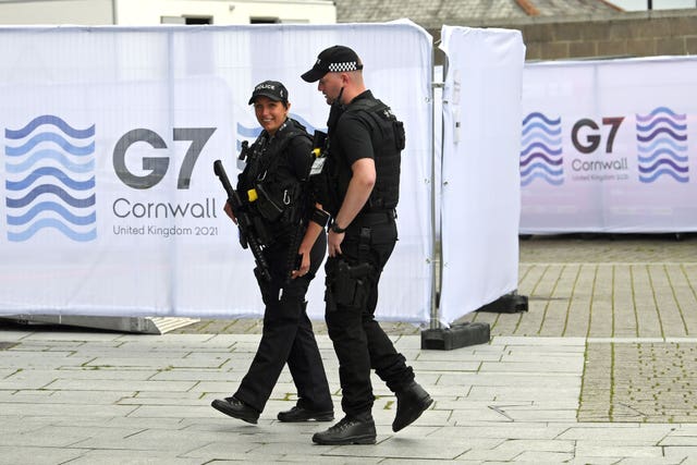 Police at the media centre in Falmouth, ahead of the G7 summit in Cornwall (Stefan Rousseau/PA)