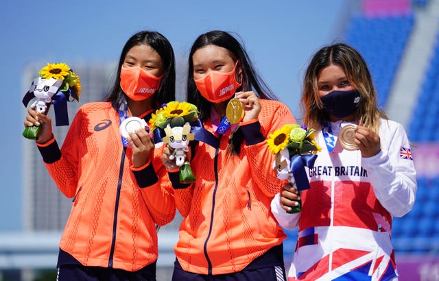 Sky Brown (right) celebrates with Japan’s Sakura Yosozumi, who won gold, and Sakura Kokona Hiraki, who won silver