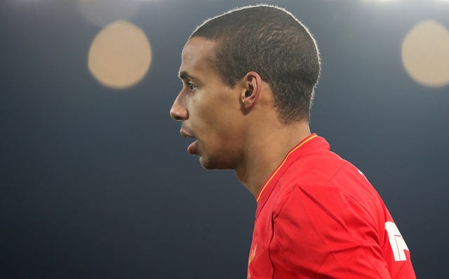 Joel Matip had to come off in the 22nd minute against Borussia Dortmund (Martin Rickett/PA).