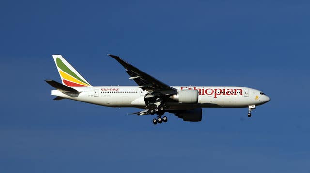 Ethiopian Airlines plane against a cloud and blue skies