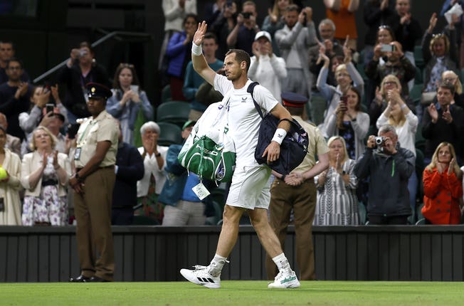 Andy Murray waves goodbye to Centre Court after a second-round exit to big-serving John Isner