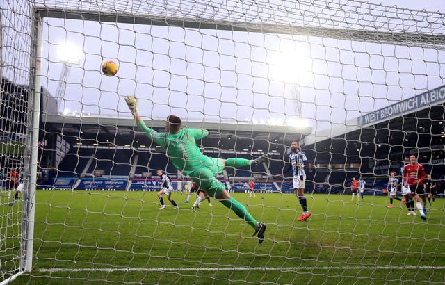 Sam Johnstone makes a save from Manchester United’s Harry Maguire