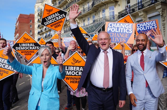 Liberal Democrat leader Sir Ed Davey (centre) arriving with deputy leader Daisy Cooper (left) and Josh Babarinde for the Liberal Democrat party conference at Brighton Centre