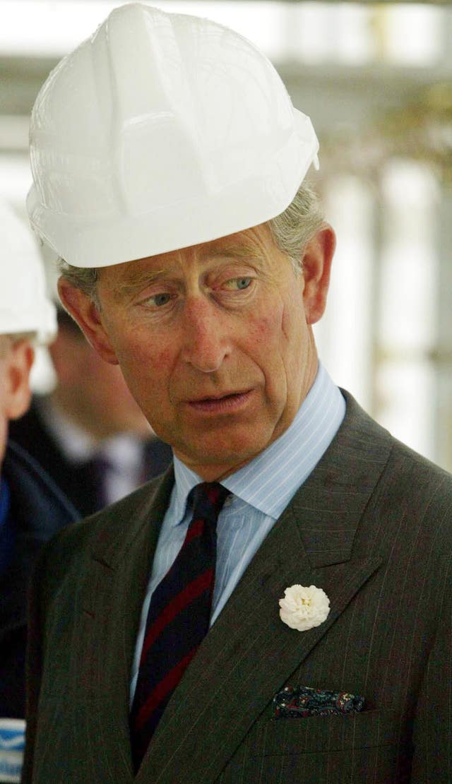 Charles wears a hard hat during a visit to Bury St Edmunds Cathedral and is likely to need one when he visits the underground electricity super highway. (Andrew Parsons/PA)