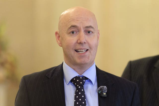 Head and shoulders photo of Jon Burrows speaking