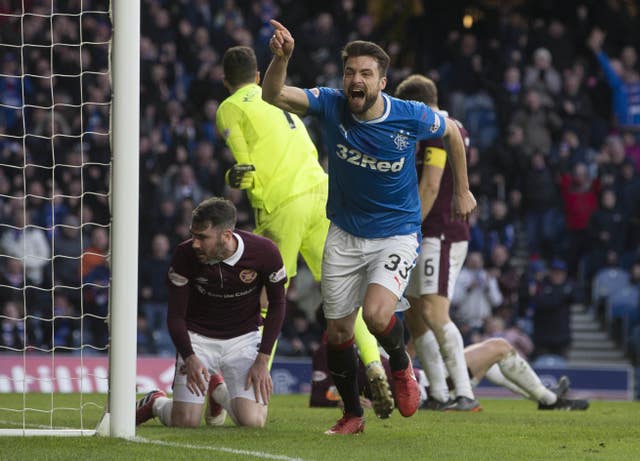 Russell Martin points his finger in the air while celebrating a goal