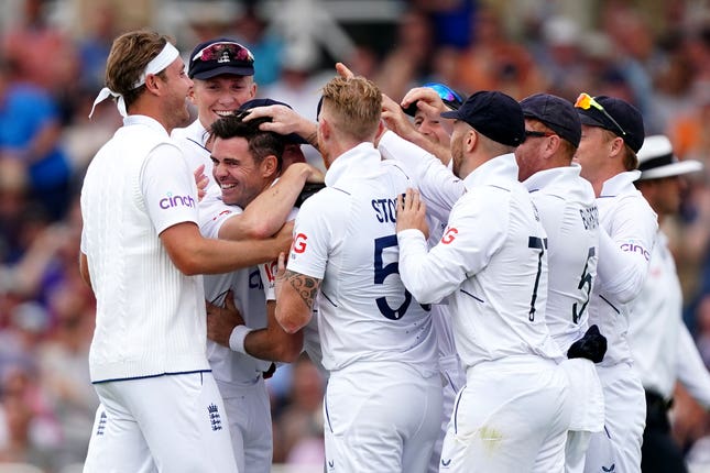 James Anderson (centre) is congratulated by England teammates