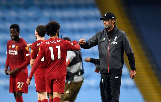 Jurgen Klopp (right) says Liverpool will come again