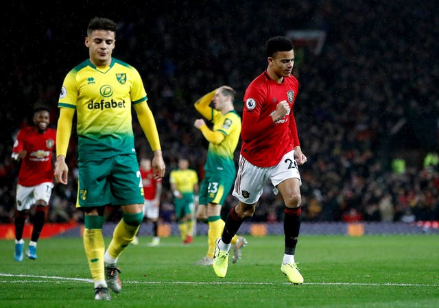 Manchester United’s Mason Greenwood celebrates scoring from the bench