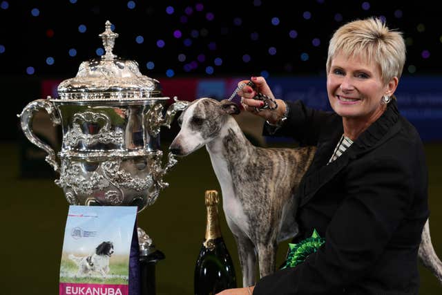 Tease, the Whippet, with owner Yvette Short after she was named Supreme Champion during the final day of Crufts 2018 at the NEC in Birmingham