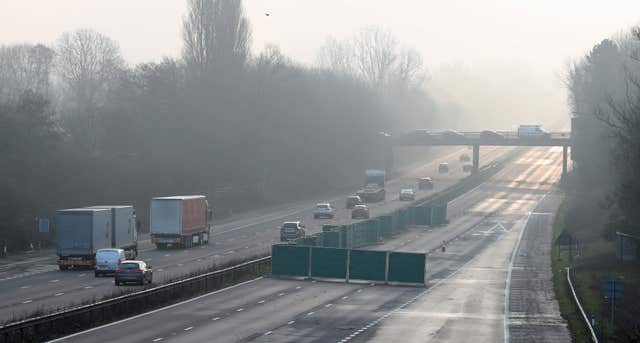 Traffic on the M20 in Kent passes a screen on the adjacent carriageway before the second carriageway was closed (Gareth Fuller/PA)