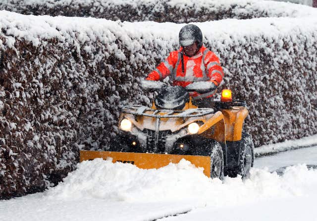 Jim Dunbar clears the snow in Braco, Perthshire, as parts of the country were blanketed in snow (Andrew Milligan/PA)