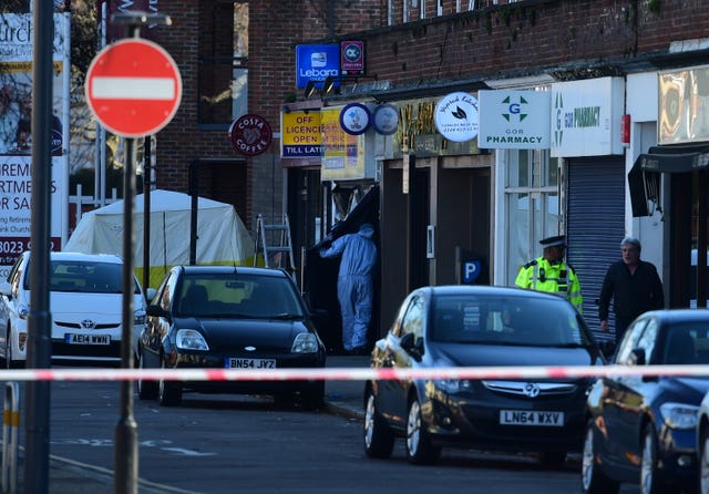 Forensic officers outside Marsh Food and Wine in Marsh Road, Pinner