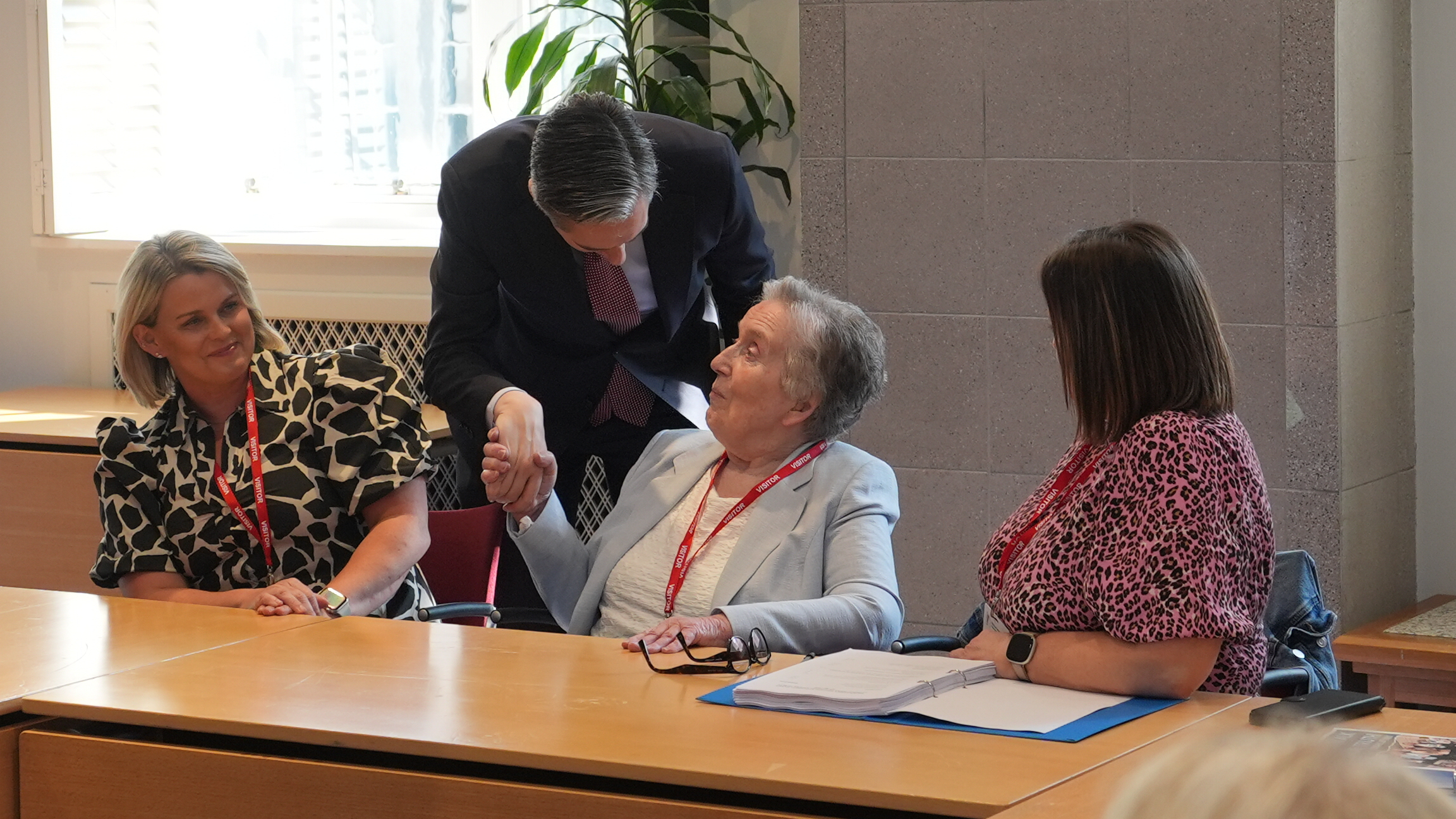 Simon Harris speaking to Sean Brown's widow and daughters in Dublin last week