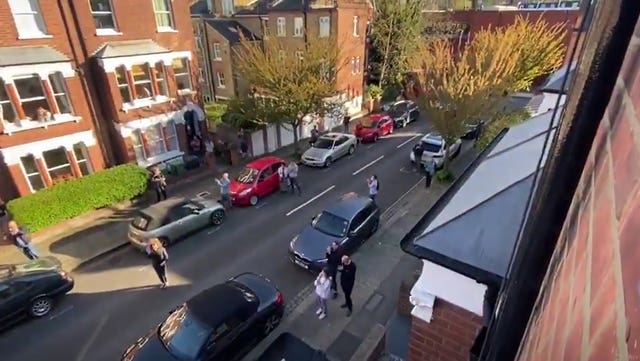 Undated handout screengrab photo issued by Ruth Gibson of neighbours cheering on the actor as she performed Romeo and Juliet from her window to cheer up neighbours during lockdown.