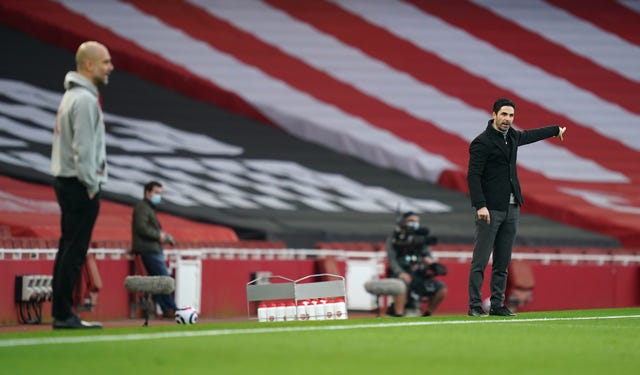 Manchester City manager Pep Guardiola, left, and Arsenal boss Mikel Arteta