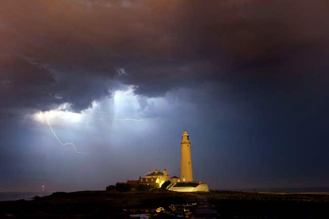 St Mary's Lighthouse near Whitley Bay with a lightning strom in the background