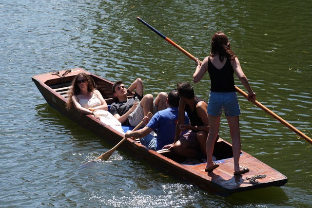 People enjoying the warm weather while on the River Cam in Cambridge on Monday