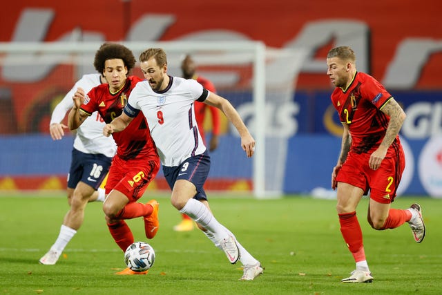 Kane tries to drive the ball forward in Leuven