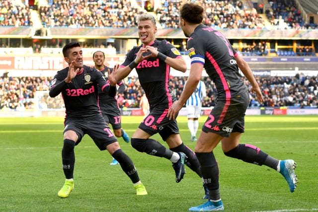 Leeds' Ezgjan Alioski scored as the Whites won their West Yorkshire derby 2-0 against Huddersfield