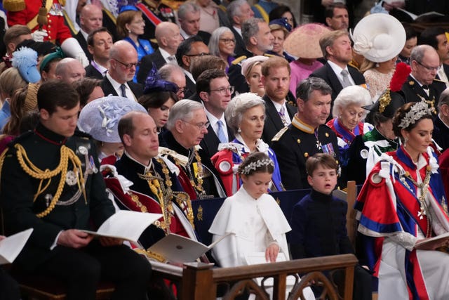 Harry in the third row behind the Waleses, the Duke and Duchess of Gloucester and Vice Admiral Timothy Laurence
