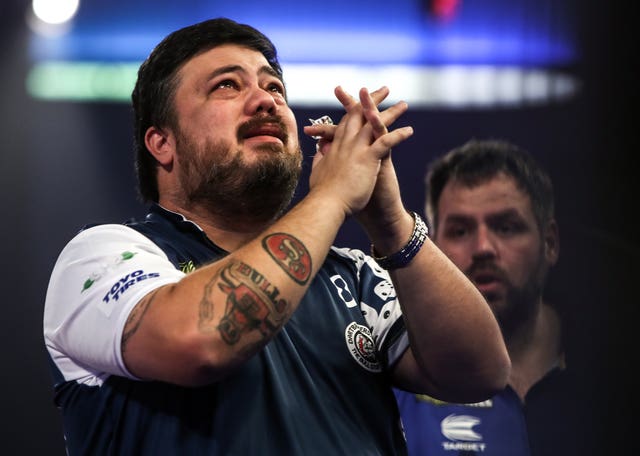 Danny Baggish (left) cries after beating Adrian Lewis (right) at the PDC World Championship