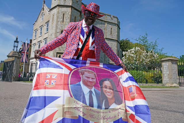 Royal fan Joseph Afrane from London outside Windsor Castle on rehearsal day ahead of the wedding (Owen Humphreys/PA)