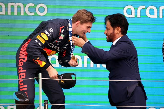 Max Verstappen gets a medal from Mohammed Ben Sulayem,