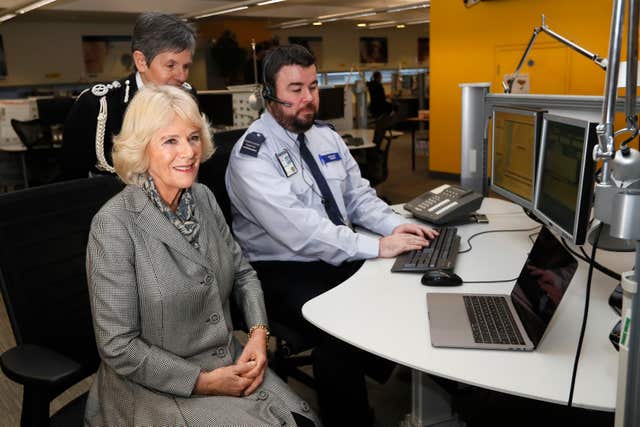 The Duchess of Cornwall, with the Metropolitan Police Commissioner Cressida Dick (left), during a visit to Met Police offices to learn about a device keeping domestic abuse victims safe (PA Wire/PA Images)