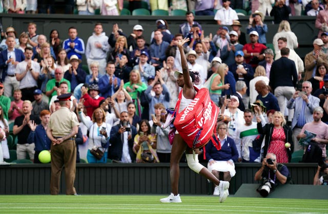 Venus Williams waves to the crowd after her first-round defeat