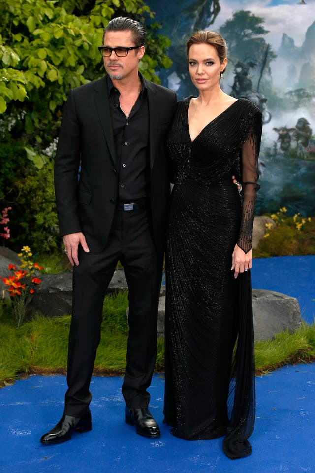 Brad Pitt and Angelina Jolie attending the premiere of Maleficent at Kensington Palace, London