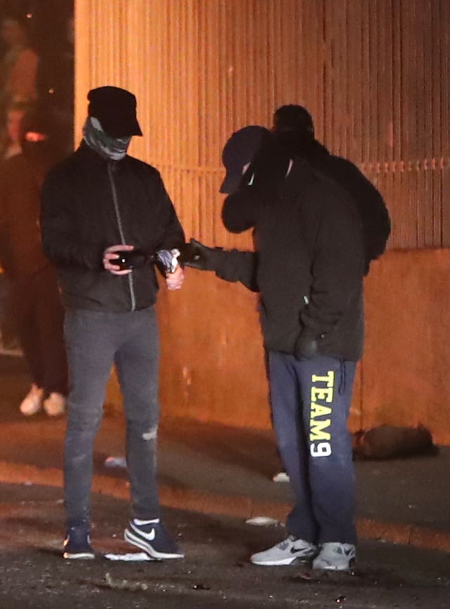 Rioters threw petrol bombs at police during the disturbance in Creggan, Londonderry (Niall Carson/PA)