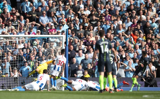 Mahrez scores City's third as a 4-1 win at Brighton secures the title