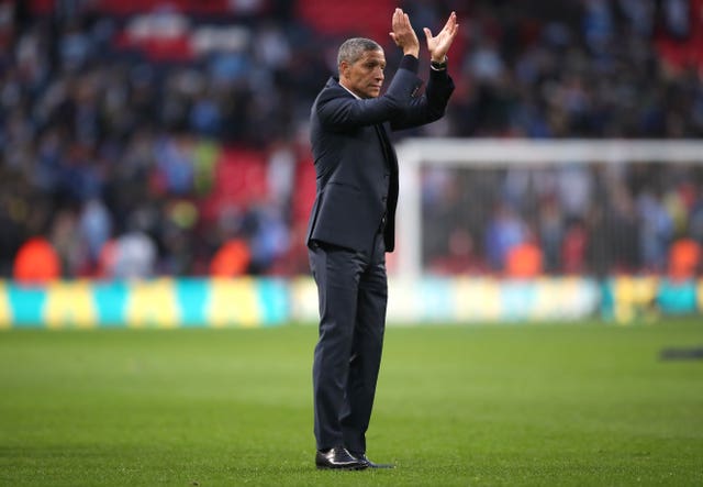 Brighton manager Chris Hughton applauds the fans 