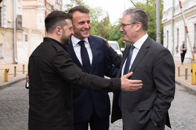 Ukrainian President Volodymyr Zelensky, French President Emmanuel Macron and Prime Minister Sir Keir Starmer tour the streets of Kyiv, Ukraine, after they attended a meeting of the so-called “coalition of the willing” at the Presidential Palace
