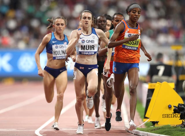 Laura Muir, centre, runs on the shoulder of race winner Sifan Hassan, right