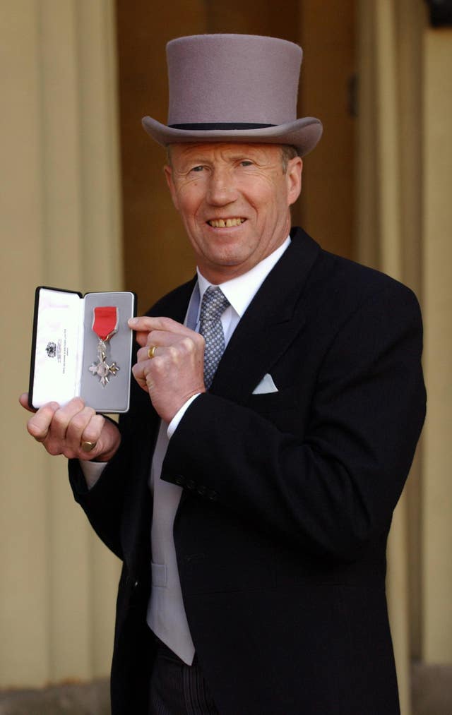 Bell was awarded an MBE for services to the community in 2004