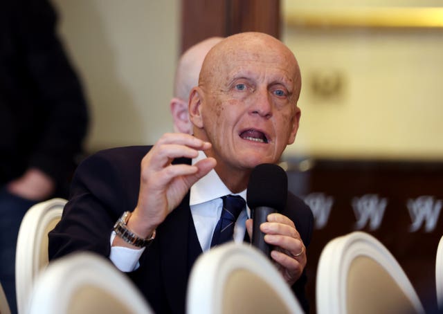 Pierluigi Collina asks a question during a conference