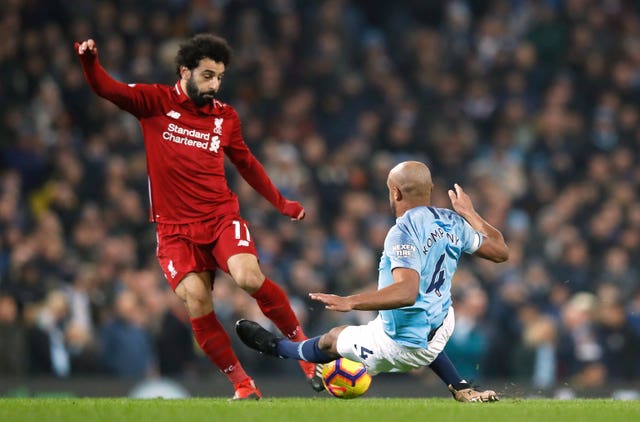 Vincent Kompany was booked for this challenge on Mohamed Salah