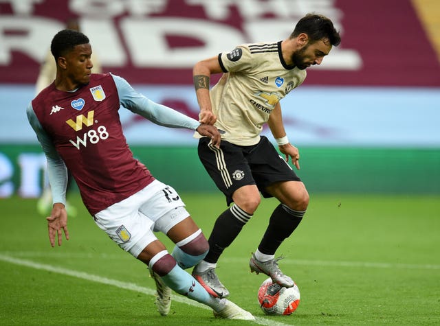 Aston Villa defender Ezri Konsa, left, was ruled to have fouled Manchester United's Bruno Fernandes