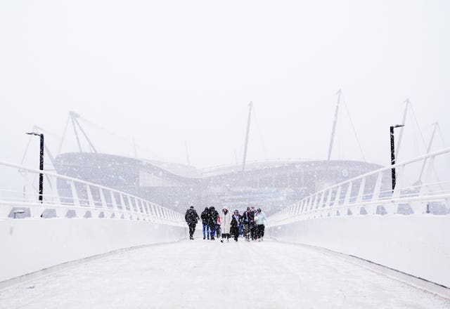 The approach to Manchester City's Etihad Stadium is shrouded in snow