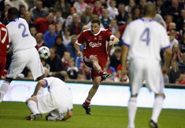 Former Liverpool striker John Aldridge takes a shot