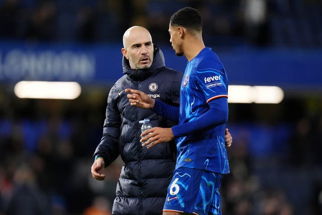 Chelsea manager Enzo Maresca, left, and Levi Colwill talk after a match