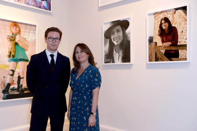 With then-Vogue editor Alexandra Shulman in front of two portraits of the then-Duchess of Cambridge, which featured in the Vogue 100: A Century Of Style exhibition, at the National Portrait Gallery