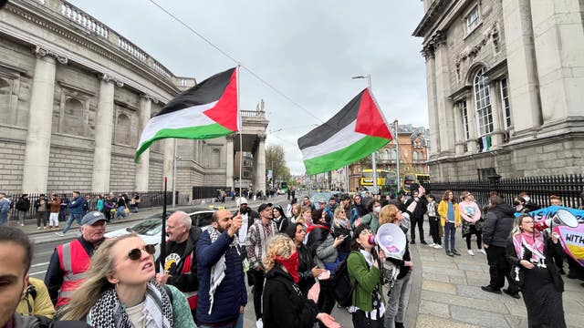 Protesters gathered outside Trinity College on Saturday where the students had set up camp